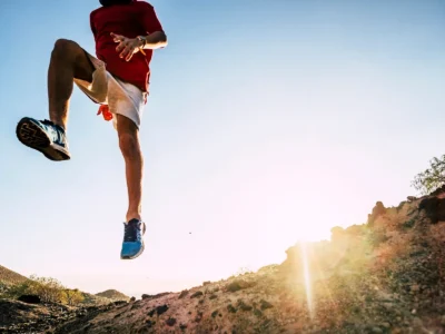 teenager-running-alone-at-the-mountain-with-sunset-man-jogging-positive-vibes-jumping